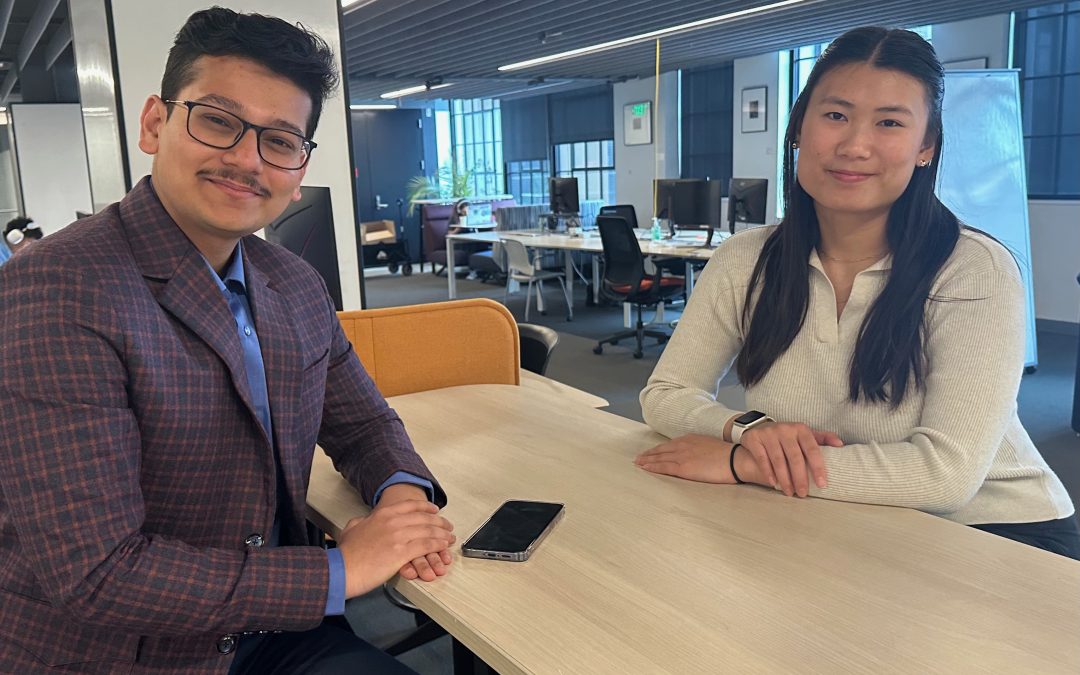 Sayandeep Biswas and Alexis Huynh sitting at worktable